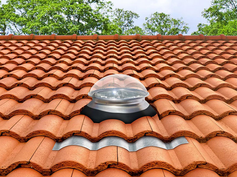 Kennedy tubular skylight installed on tile roof with tile skirt
